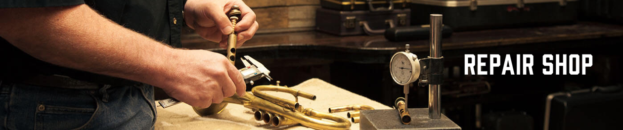 Repairing valves on a trumpet.